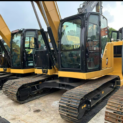 목재 처리용 중고 Caterpillar CAT 310 유압 회전식 그래브 굴삭기